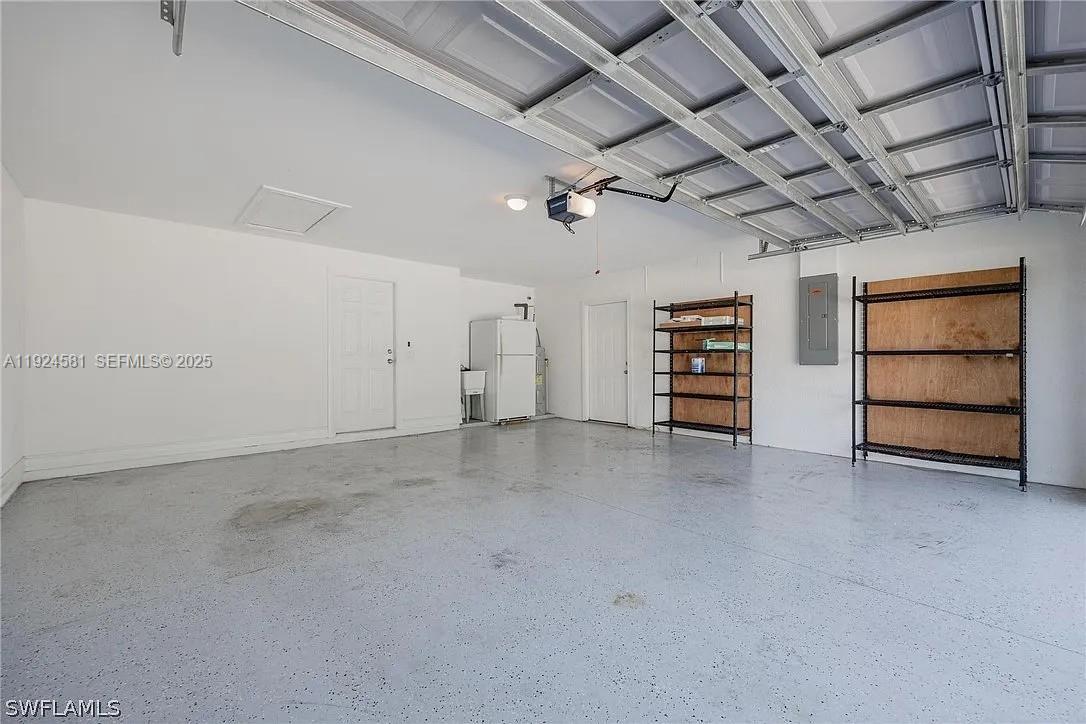 830 Angelo Avenue Lehigh Acres, FL 33971 - Photo 9 of 29 a view of an empty room with a white walls