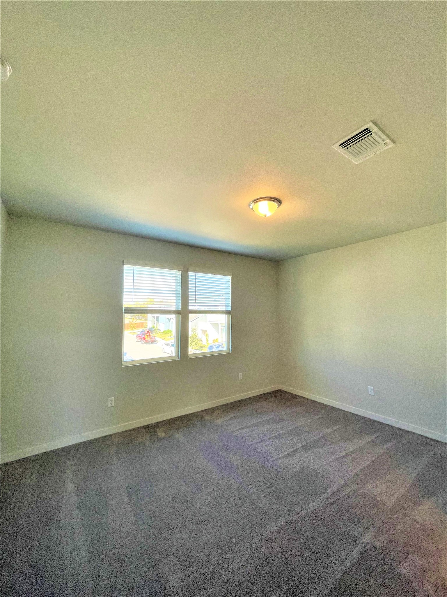 15110 Forum Avenue Pflugerville, TX 78660 - Photo 14 of 29 an empty room with a empty space and windows