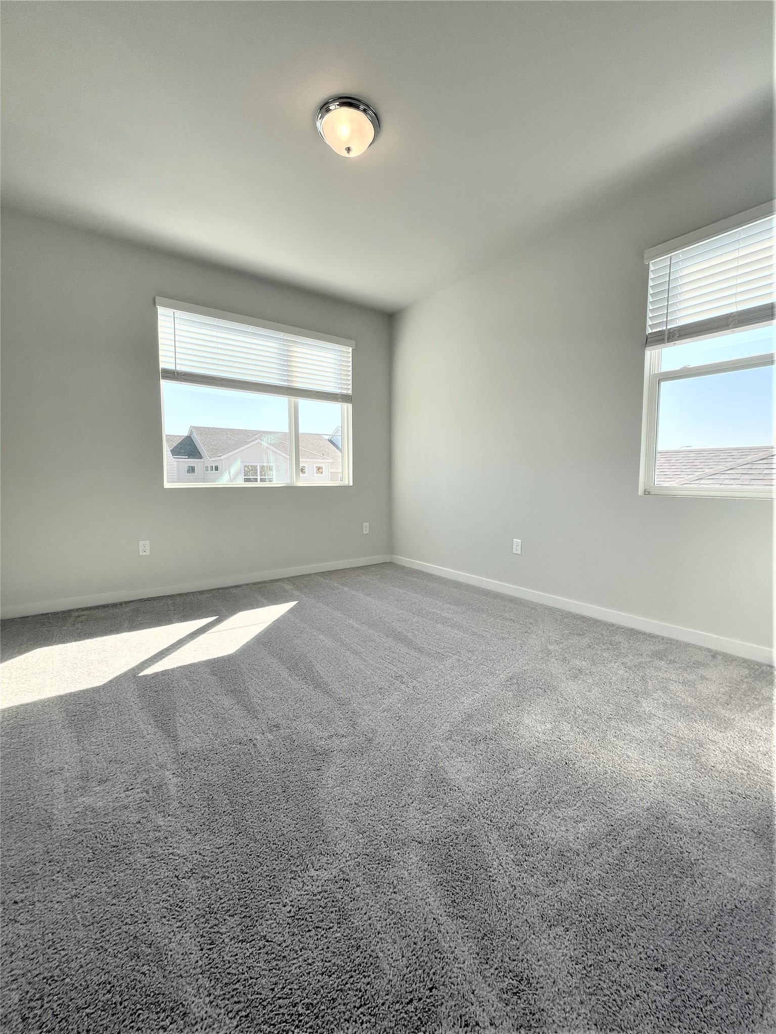 15110 Forum Avenue Pflugerville, TX 78660 - Photo 23 of 29 an empty room with a empty space and windows