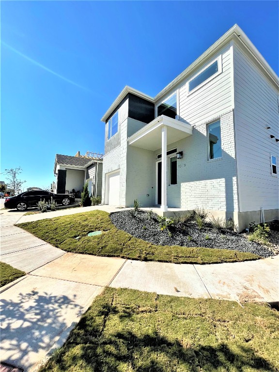 15110 Forum Avenue Pflugerville, TX 78660 - Photo 4 of 29 a front view of a house with a yard