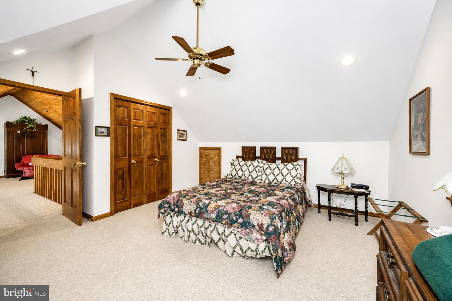 389 Sawmill Hollow Road Swanton, MD 21561 - Photo 29 of 62 a bedroom with a bed and a chandelier