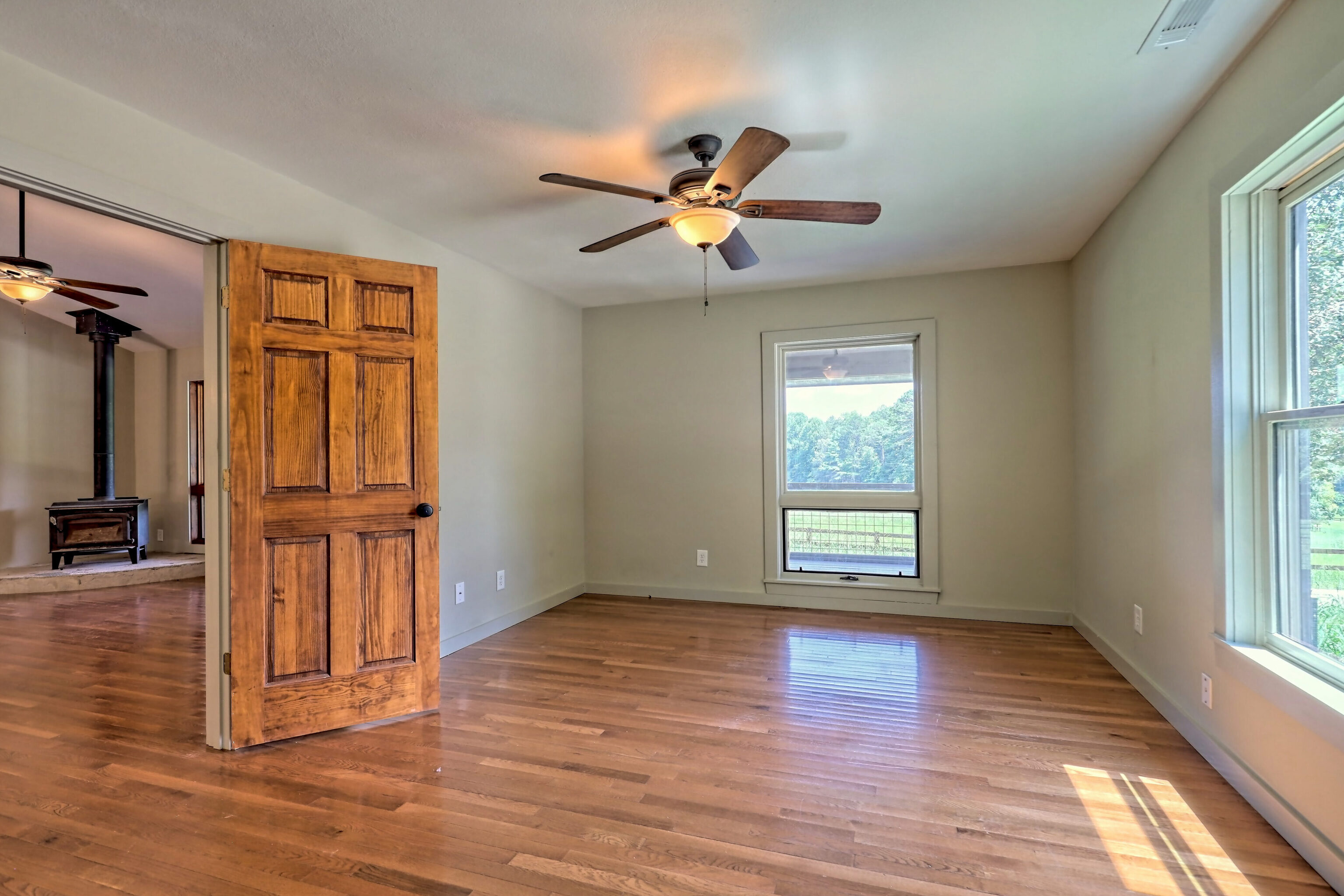 3622 Sandy Ford Road Clayton, GA 30525 - Photo 155 of 182 a view of an empty room with wooden floor and a window