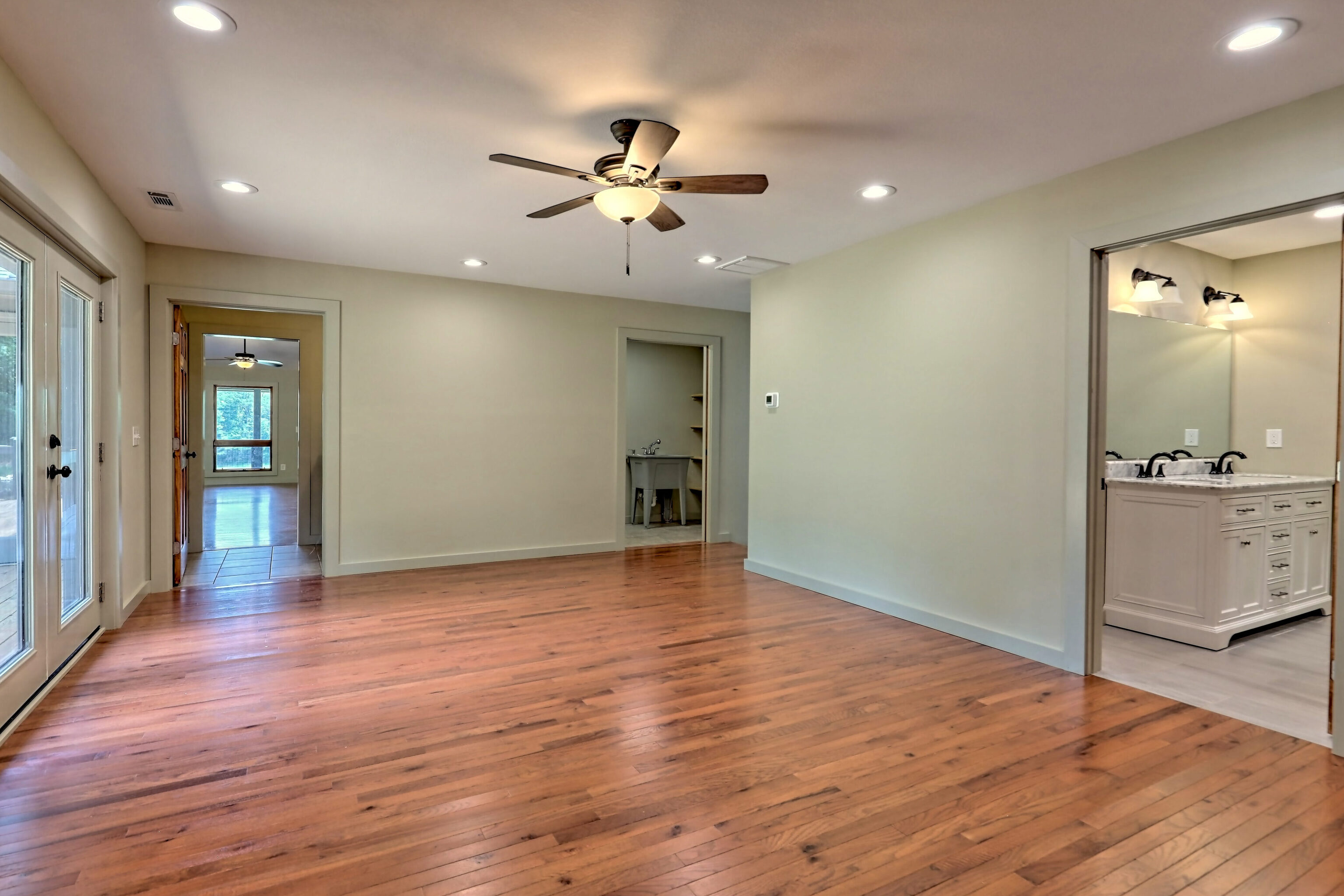 3622 Sandy Ford Road Clayton, GA 30525 - Photo 159 of 182 a view of an empty room with wooden floor and a window