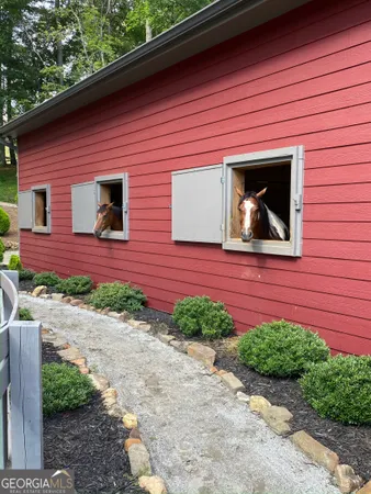 a view of a swimming pool with a yard