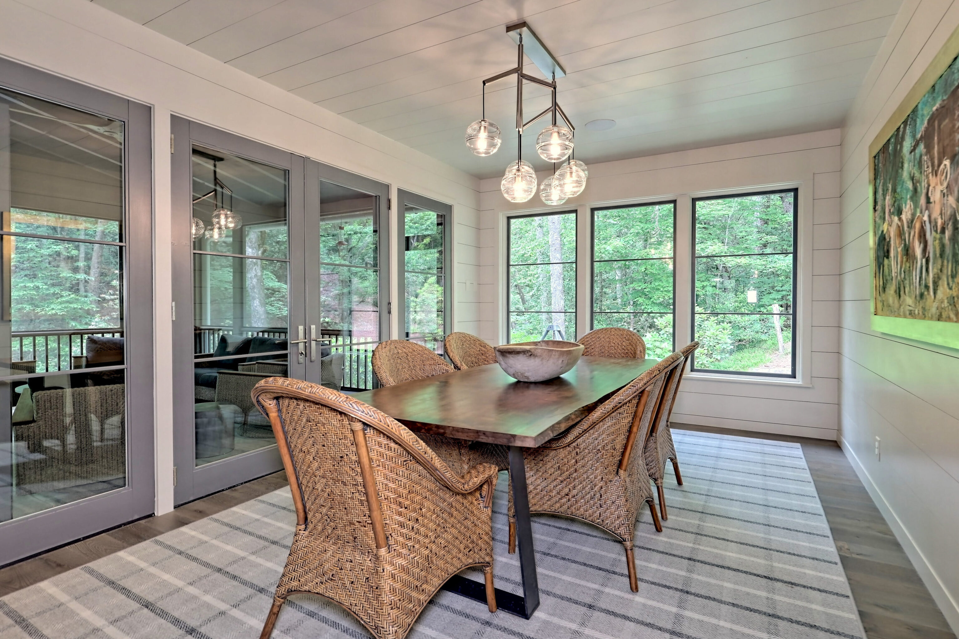 3622 Sandy Ford Road Clayton, GA 30525 - Photo 41 of 182 a view of a dining room with furniture large windows and wooden floor