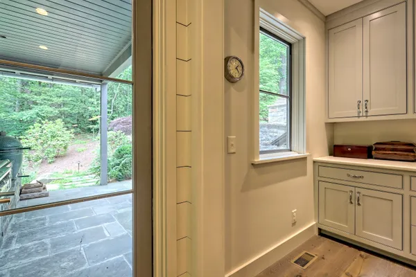 a bathroom with a granite countertop sink a mirror and a shower