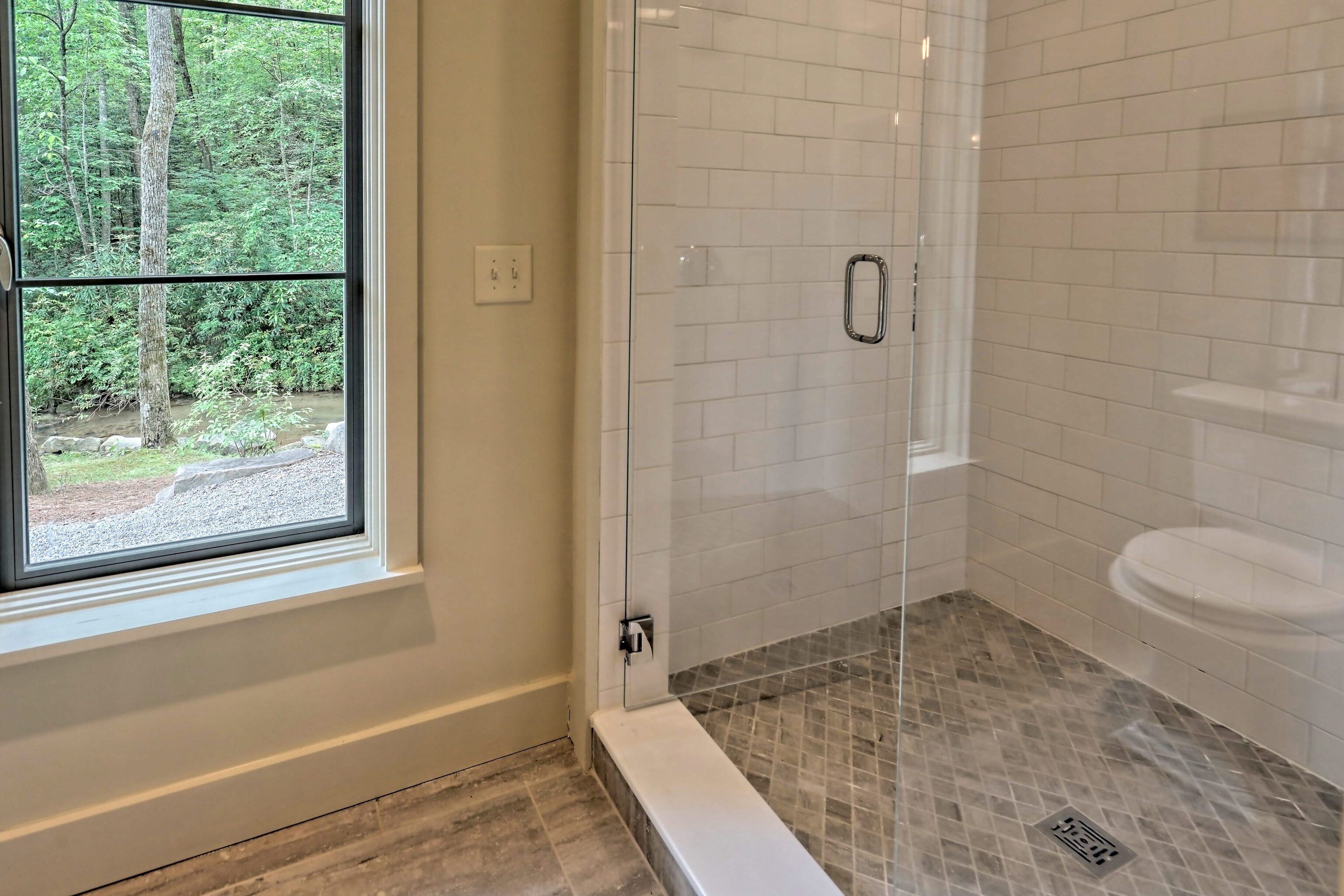 3622 Sandy Ford Road Clayton, GA 30525 - Photo 82 of 182 a bathroom with a granite countertop bathtub and a shower