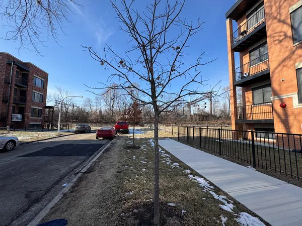 a view of a street with cars on city street