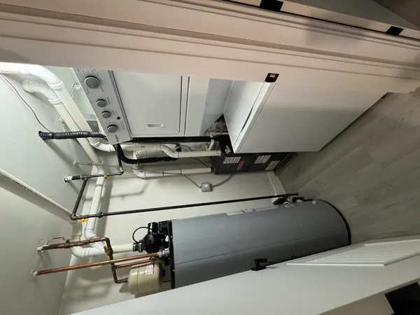 a utility room with multiple dryer and washer