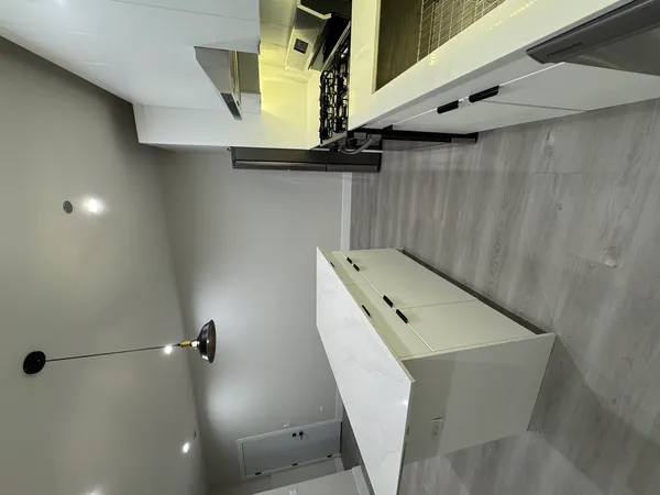 a bathroom with a sink and mirror