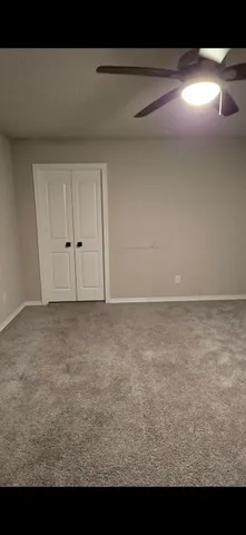 a bathroom with a double vanity sink and mirror