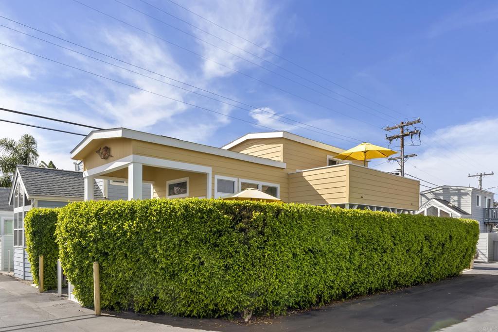 1624 North Coast Highway 101, Unit 2 Encinitas, CA 92024 - Photo 6 of 43 a front view of a house with a garden