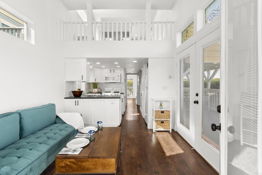 1624 North Coast Highway 101, Unit 2 Encinitas, CA 92024 - Photo 8 of 43 a living room with furniture and a wooden floor