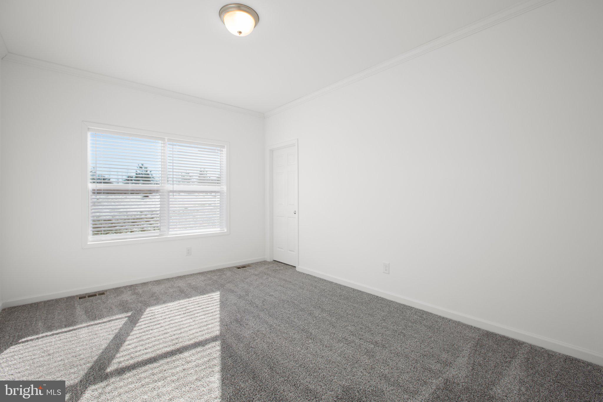 1005 Levi Road Green Bay, VA 23942 - Photo 19 of 34 an empty room with a window