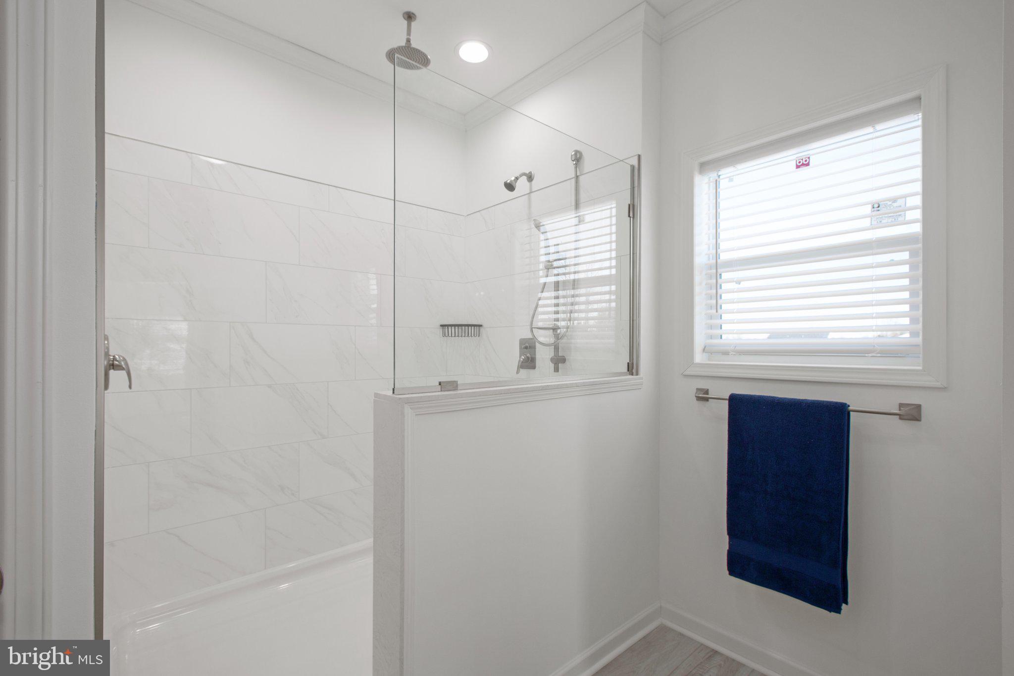 1005 Levi Road Green Bay, VA 23942 - Photo 32 of 34 a bathroom with a window and a shower