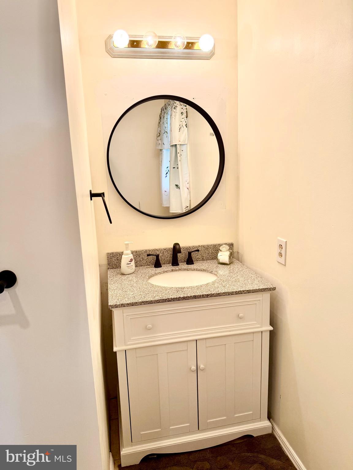 280 Progress Street Riverside, NJ 08075 - Photo 14 of 20 a bathroom with a sink and a mirror
