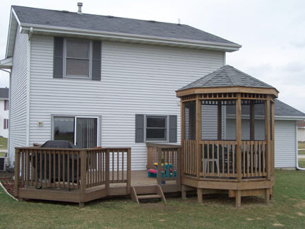 5428 Torque Road Loves Park, IL 61111 - Photo 4 of 5 a view of a house with wooden deck and a yard