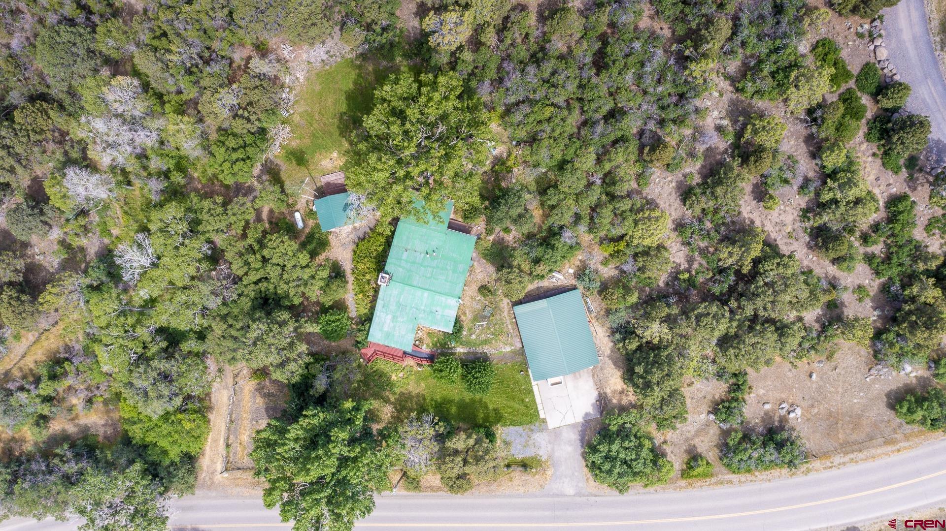 20327 Ward Creek Road Cedaredge, CO 81413 - Photo 33 of 35 an aerial view of a house with a yard and garden