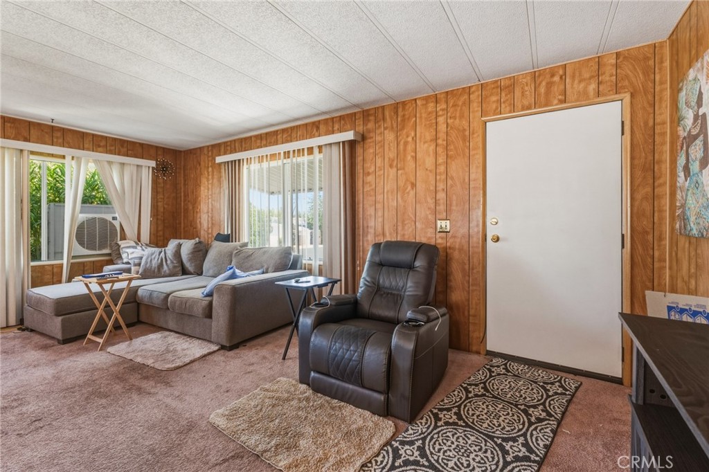20683 Waalew Road, Unit B201 Apple Valley, CA 92307 - Photo 8 of 32 a living room with furniture and a window