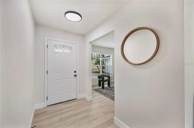 a bathroom with a sink mirror and toilet