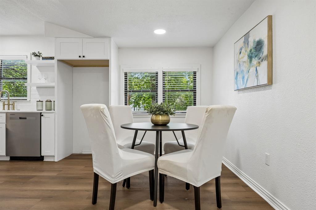 806 North Ruddell Street Denton, TX 76209 - Photo 15 of 26 a view of a dining room with furniture window and wooden floor