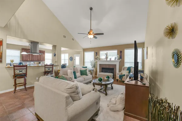 a spacious bathroom with a tub sink and mirror
