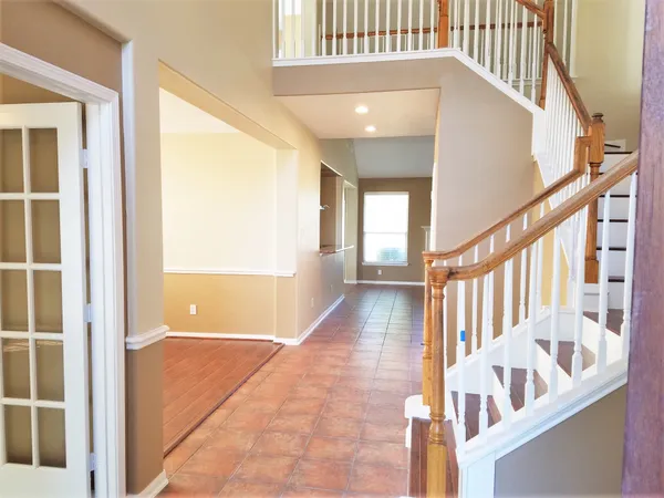 a view of a dining room with furniture and a large window