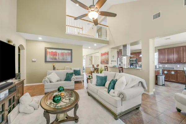 a spacious bathroom with a granite countertop tub a sink and a large mirror