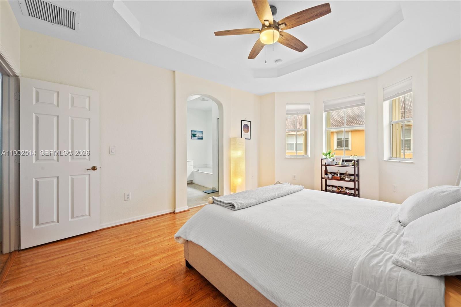 16634 Southwest 79th Terrace Miami, FL 33193 - Photo 14 of 25 a bedroom with a bed and wooden floor