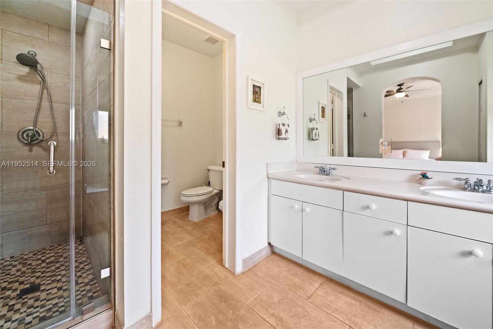 16634 Southwest 79th Terrace Miami, FL 33193 - Photo 16 of 25 a spacious bathroom with a shower sink and mirror