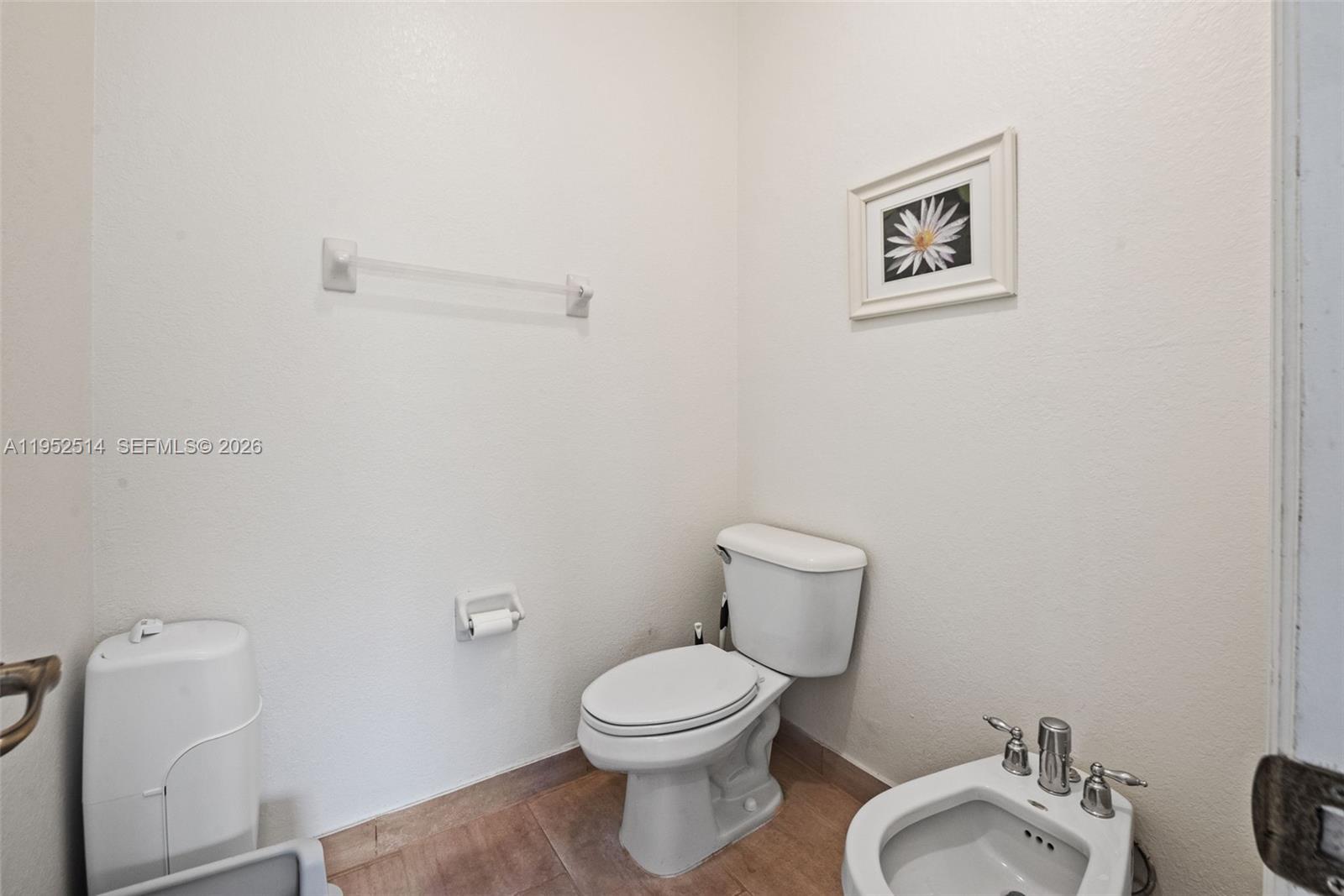 16634 Southwest 79th Terrace Miami, FL 33193 - Photo 17 of 25 a white toilet sitting next to a bathroom sink