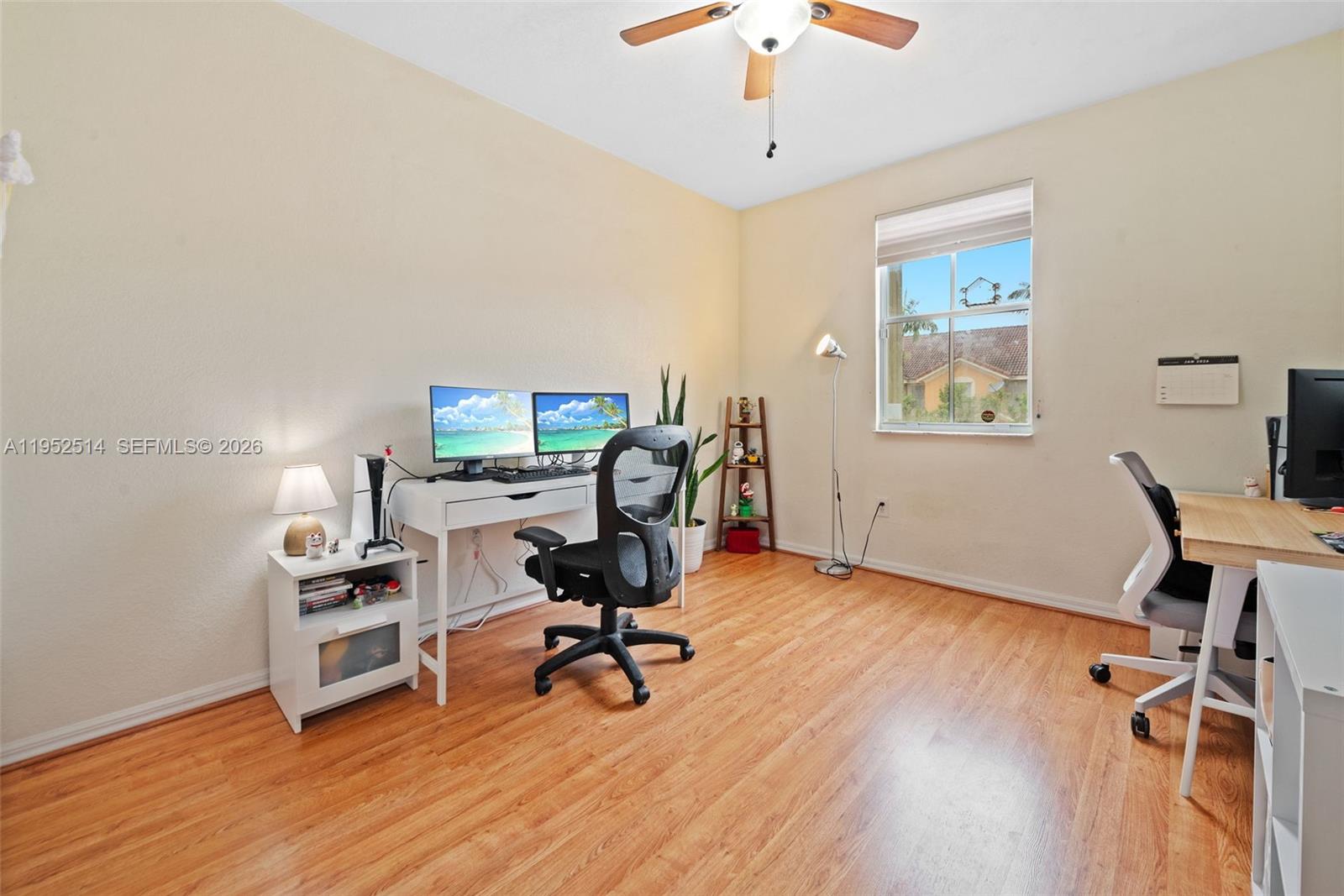 16634 Southwest 79th Terrace Miami, FL 33193 - Photo 20 of 25 a view of a workspace with furniture and a window