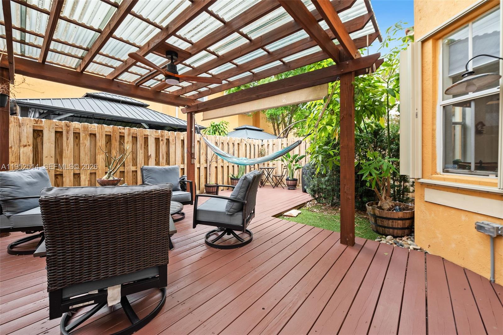 16634 Southwest 79th Terrace Miami, FL 33193 - Photo 23 of 25 a balcony with wooden floors and furniture