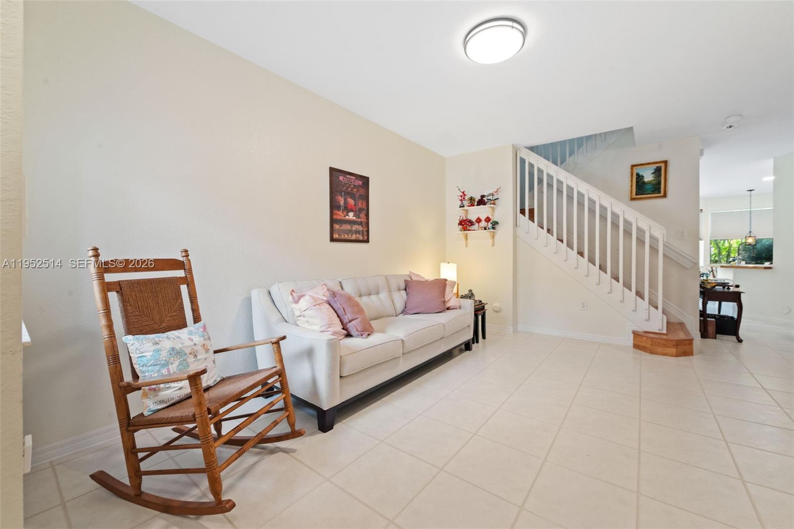 16634 Southwest 79th Terrace Miami, FL 33193 - Photo 4 of 25 a living room with furniture and a table