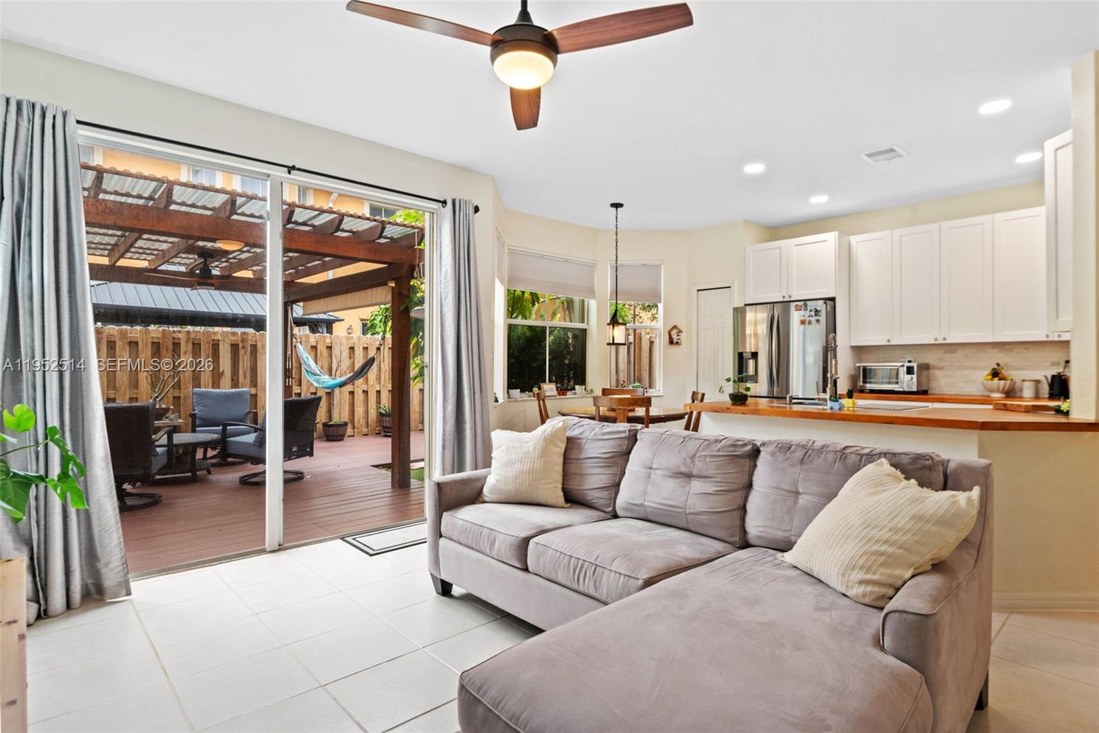 16634 Southwest 79th Terrace Miami, FL 33193 - Photo 6 of 25 a living room with furniture and a large window
