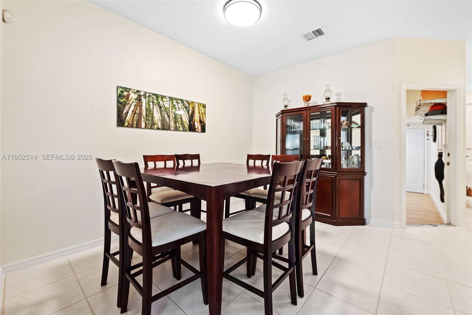 16634 Southwest 79th Terrace Miami, FL 33193 - Photo 8 of 25 a view of a dining room with furniture