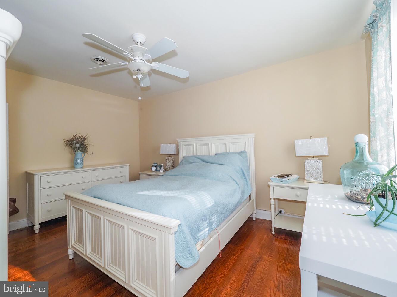 1540 Lochwood Road Baltimore, MD 21218 - Photo 19 of 46 a bedroom with a bed and a chandelier
