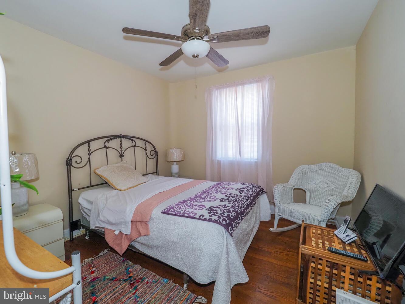1540 Lochwood Road Baltimore, MD 21218 - Photo 21 of 46 a bedroom with a bed chair and window