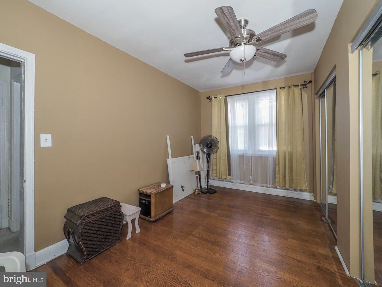 1540 Lochwood Road Baltimore, MD 21218 - Photo 24 of 46 a view of livingroom with a ceiling fan and window