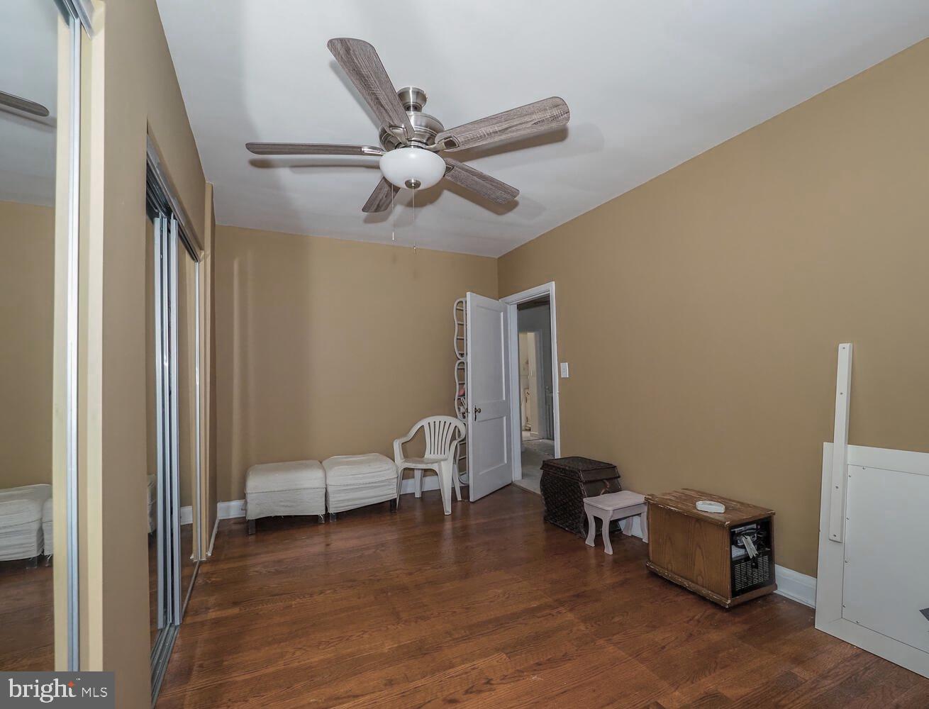 1540 Lochwood Road Baltimore, MD 21218 - Photo 25 of 46 a living room with furniture and a wooden floor