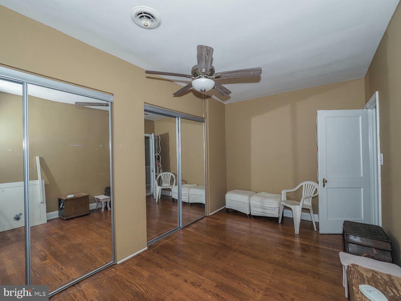 1540 Lochwood Road Baltimore, MD 21218 - Photo 26 of 46 a view of a livingroom with furniture and a ceiling fan
