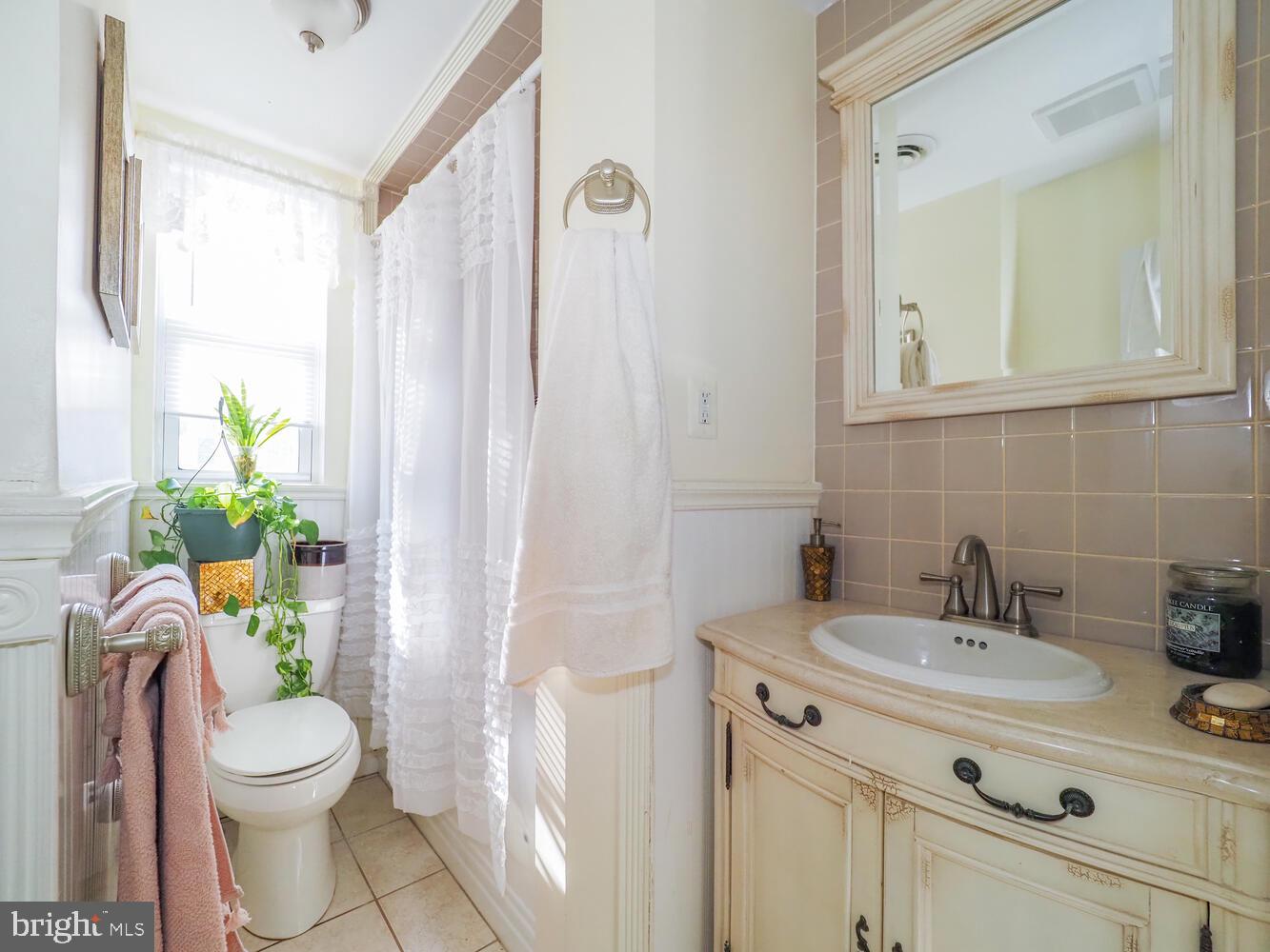 1540 Lochwood Road Baltimore, MD 21218 - Photo 27 of 46 a bathroom with a sink toilet and shower