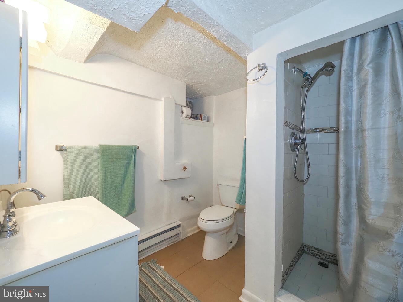 1540 Lochwood Road Baltimore, MD 21218 - Photo 32 of 46 a bathroom with a sink toilet and shower