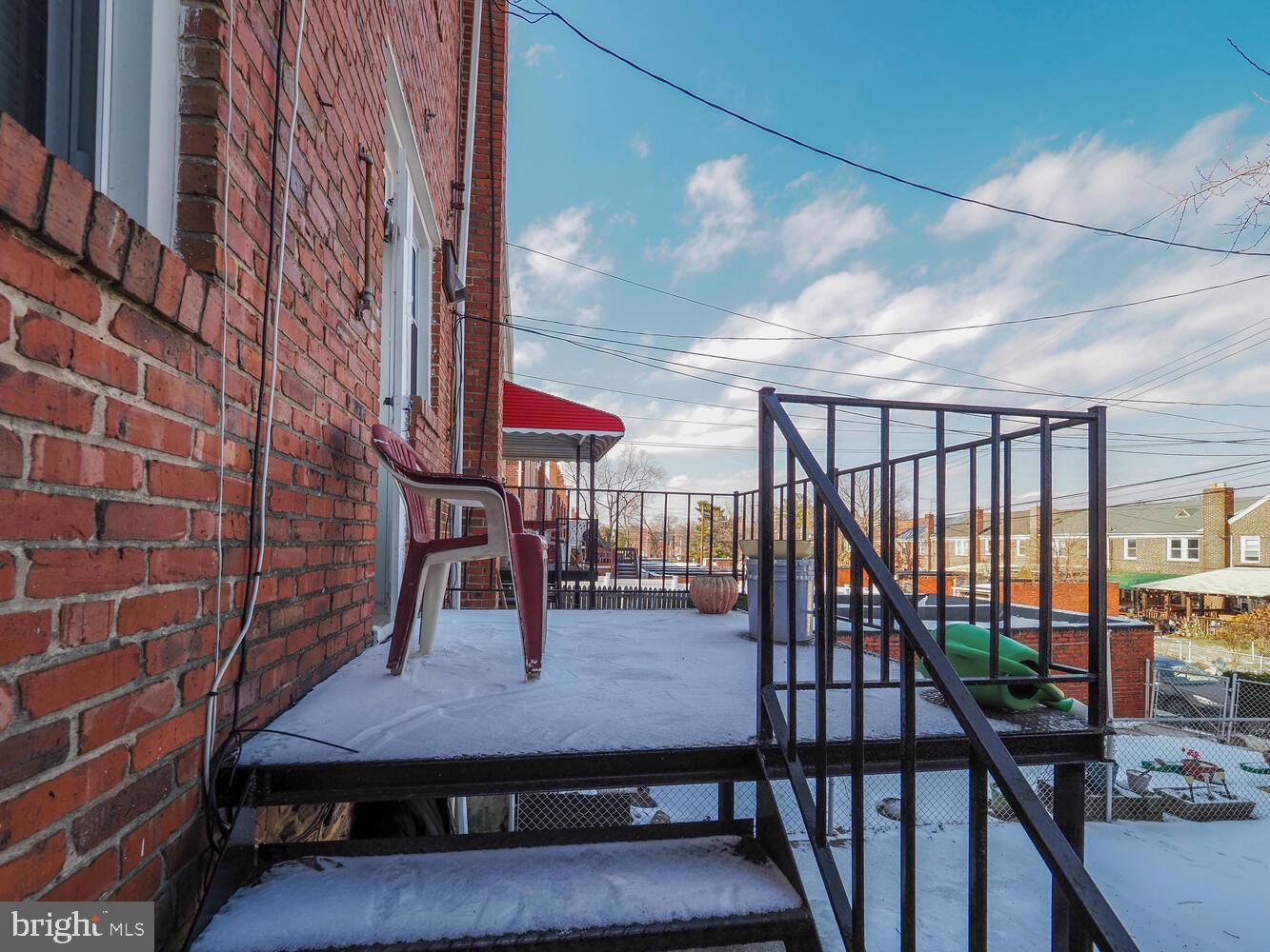 1540 Lochwood Road Baltimore, MD 21218 - Photo 40 of 46 a view of a balcony with chairs