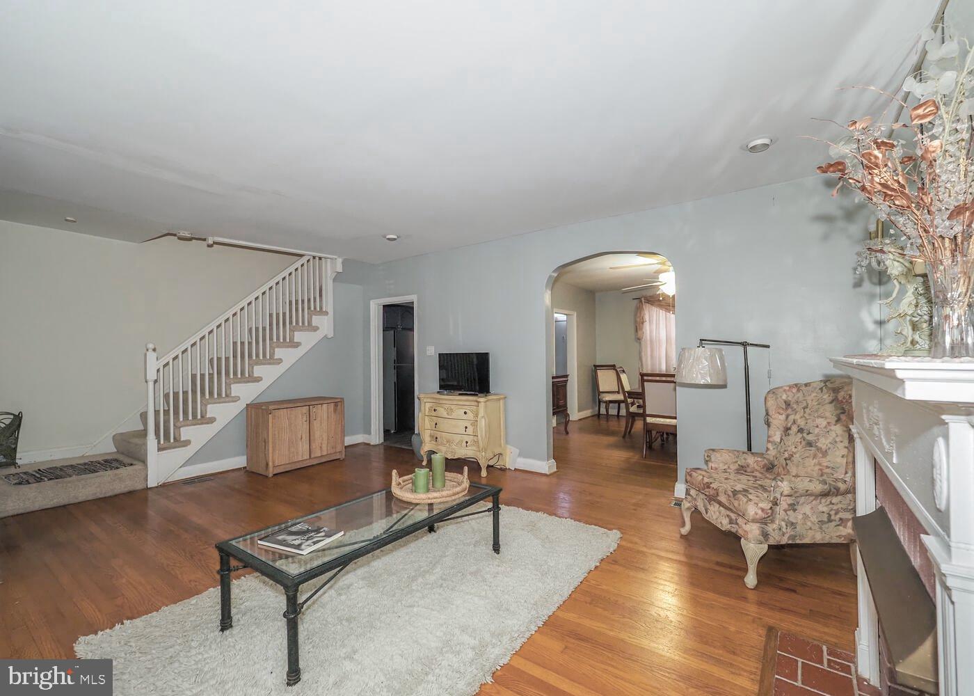 1540 Lochwood Road Baltimore, MD 21218 - Photo 6 of 46 a living room with furniture and a table