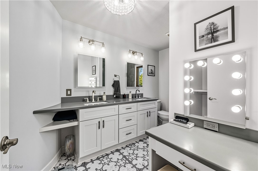 8193 Hartman Road Wadsworth, OH 44281 - Photo 26 of 50 Full bathroom featuring double vanity and toilet
