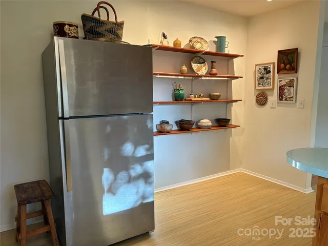 a white refrigerator freezer sitting in a kitchen