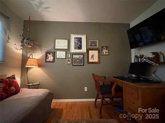 a bedroom with a bed and furniture