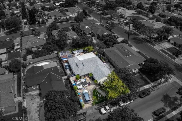 an aerial view of multiple houses with yard