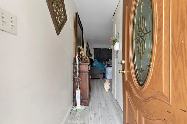 a bedroom with double bed and a chandelier